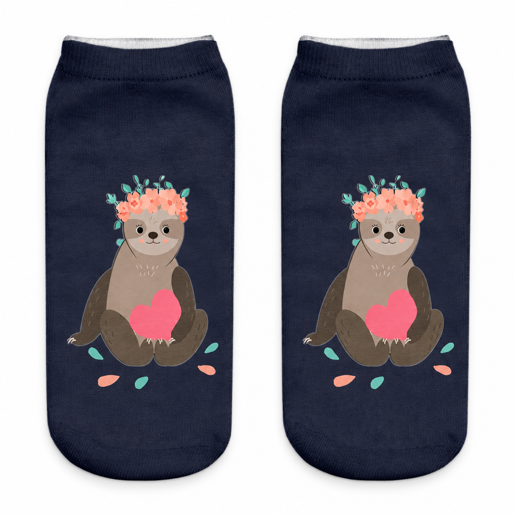 Navy ankle socks with a flower-crowned sloth print on a white background