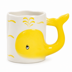 White ceramic mug with a yellow 3D whale whose tail forms the handle on a white background
