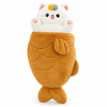 White cat plush popping out of a brown fish-shaped cake on a white background