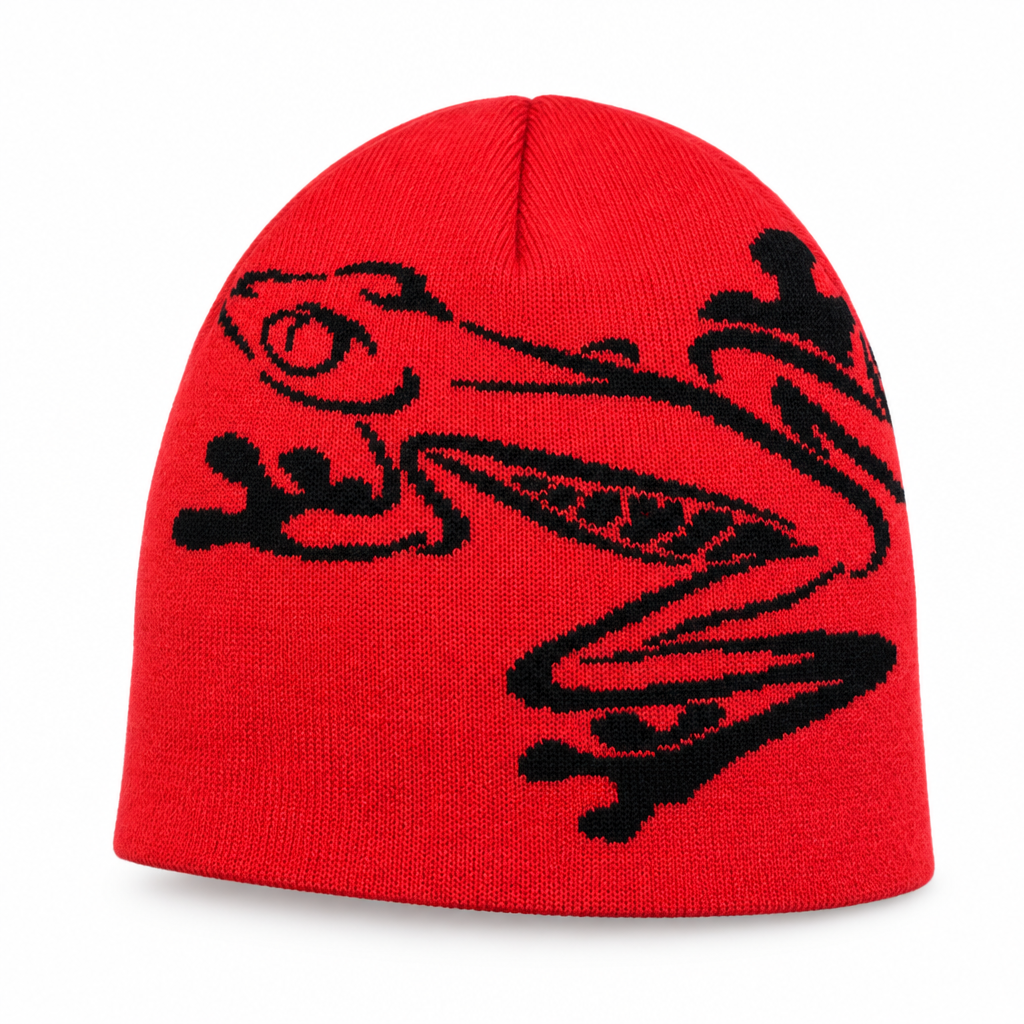Red knit beanie with a black tree frog design on a white background