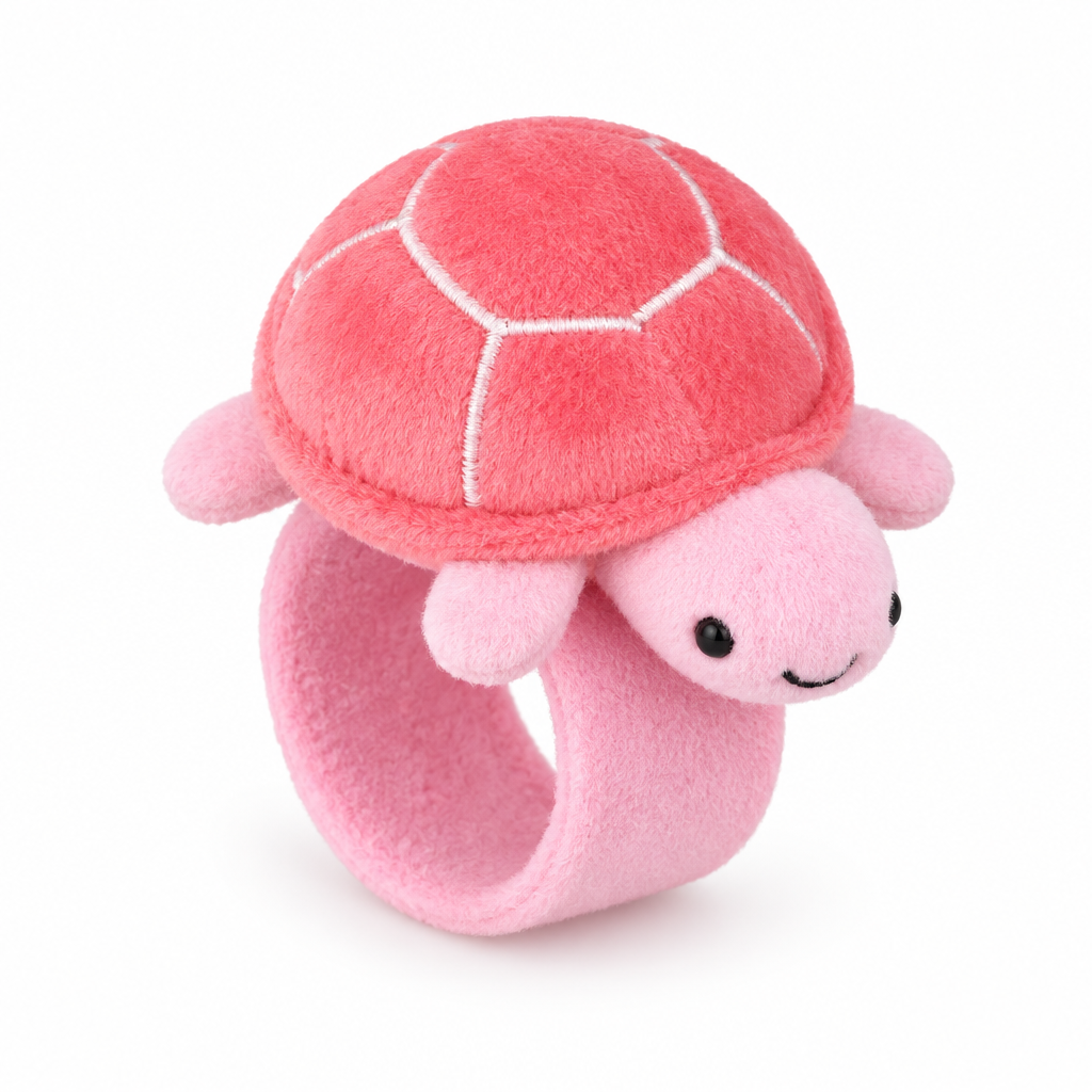 Pink plush turtle slap bracelet on a white background