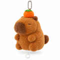 Capybara keychain with a persimmon on its head on a white background