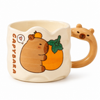 Wavy cream ceramic mug with a capybara hugging a tangerine, on a white background