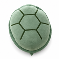 Sage green plush turtle shell pillow on a white background