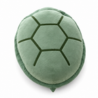 Sage green plush turtle shell pillow on a white background