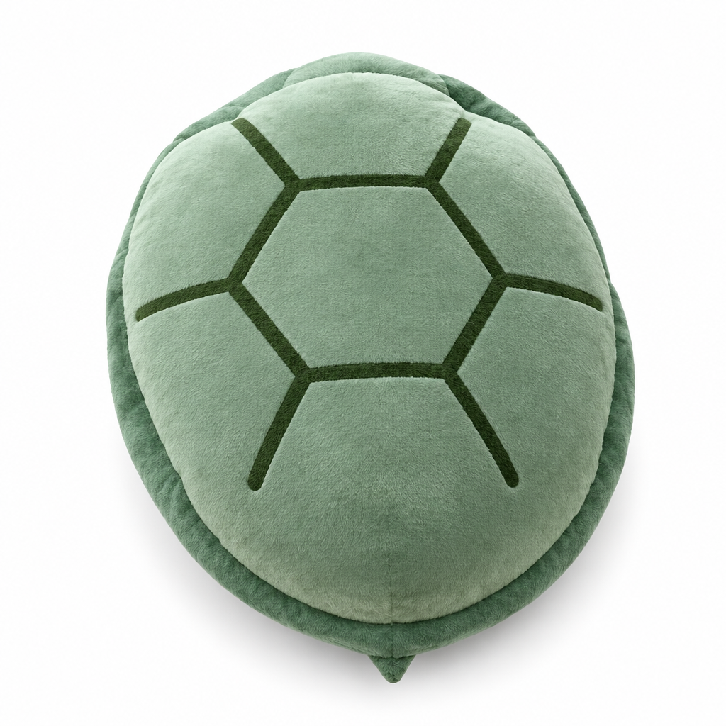 Sage green plush turtle shell pillow on a white background