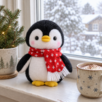 Penguin plush with a red scarf on a windowsill on a snowy day